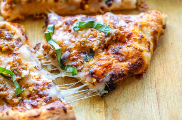 SAUSAGE AND CALABRIAN CHILI PIZZA WITH HOT HONEY